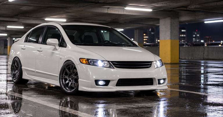 White Honda Civic in a parking structure at night, Honda and Acura high output alternators