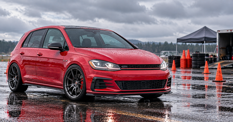Red Volkswagen Golf GTI in an autocross paddock, Volkswagen and Audi alternators